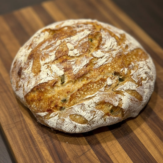 Loaf of bread on a wooden surface